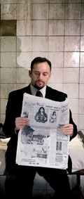 Isaacs takes a break to read the newspaper (photo: Johan Persson)